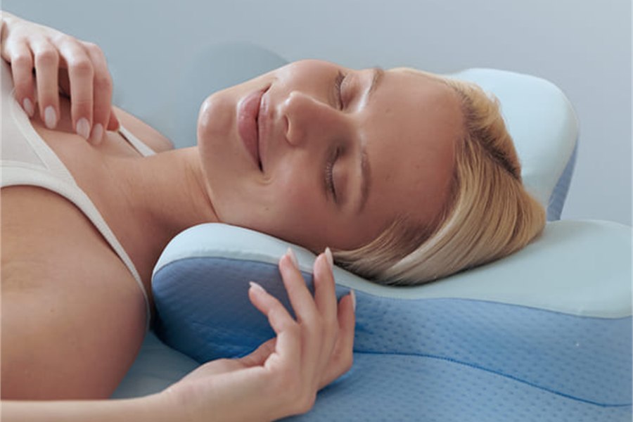 A woman relaxing comfortably with her head resting on the pillow